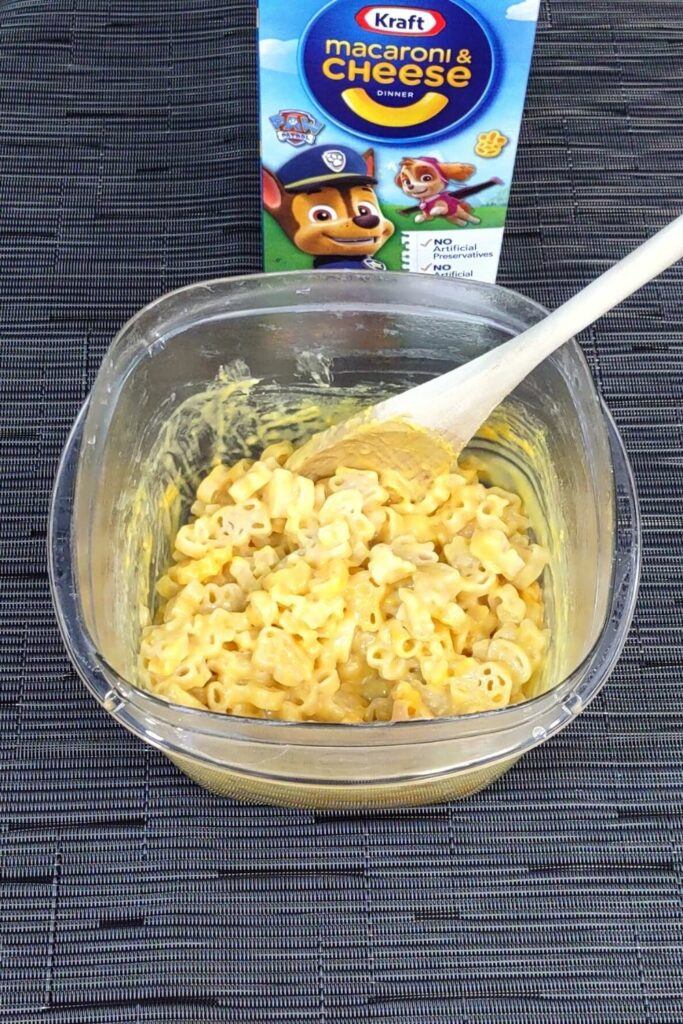 stir in mac and cheese powder and milk until it is mixed