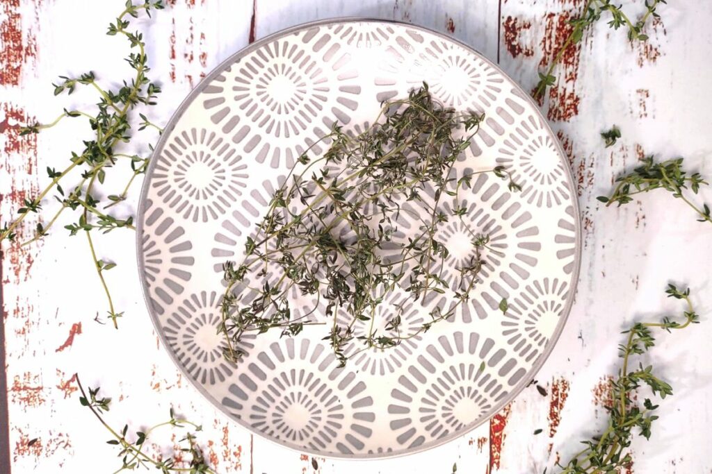 thyme dehydrated in the air fryer spread across plate