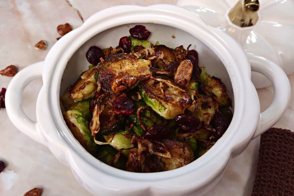 microwave balsamic honey brussel sprouts in a white pumpkin bowl