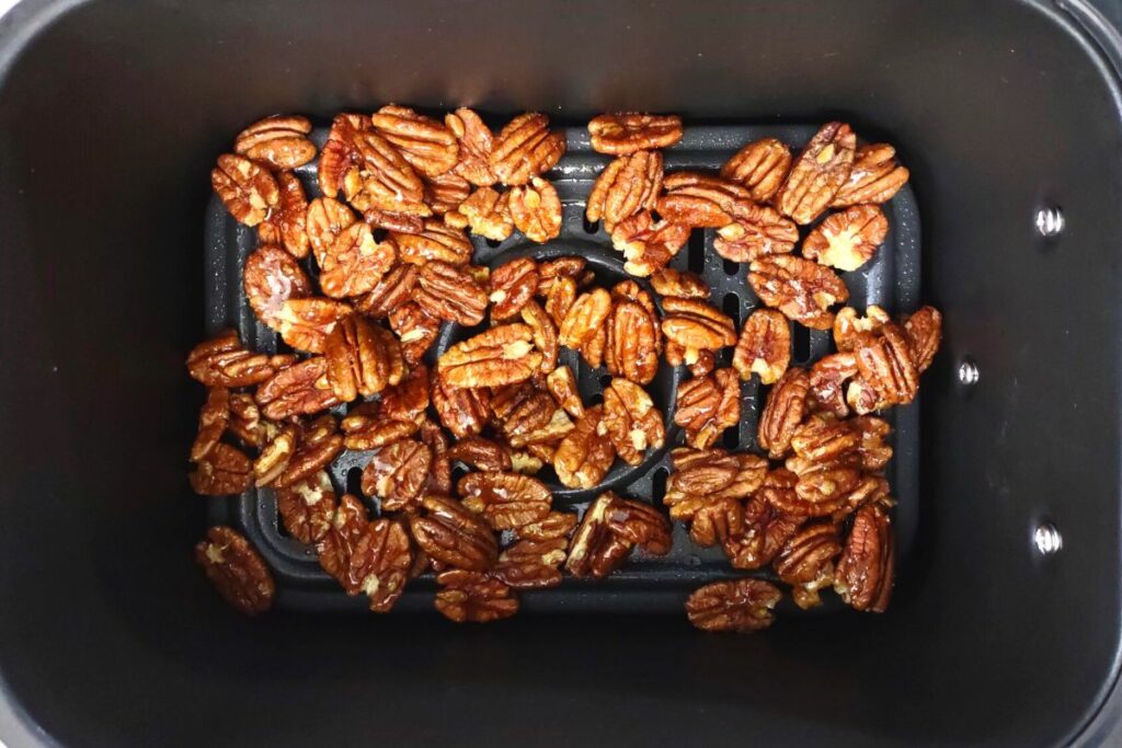 add raw pecans coated in honey to preheated air fryer basket