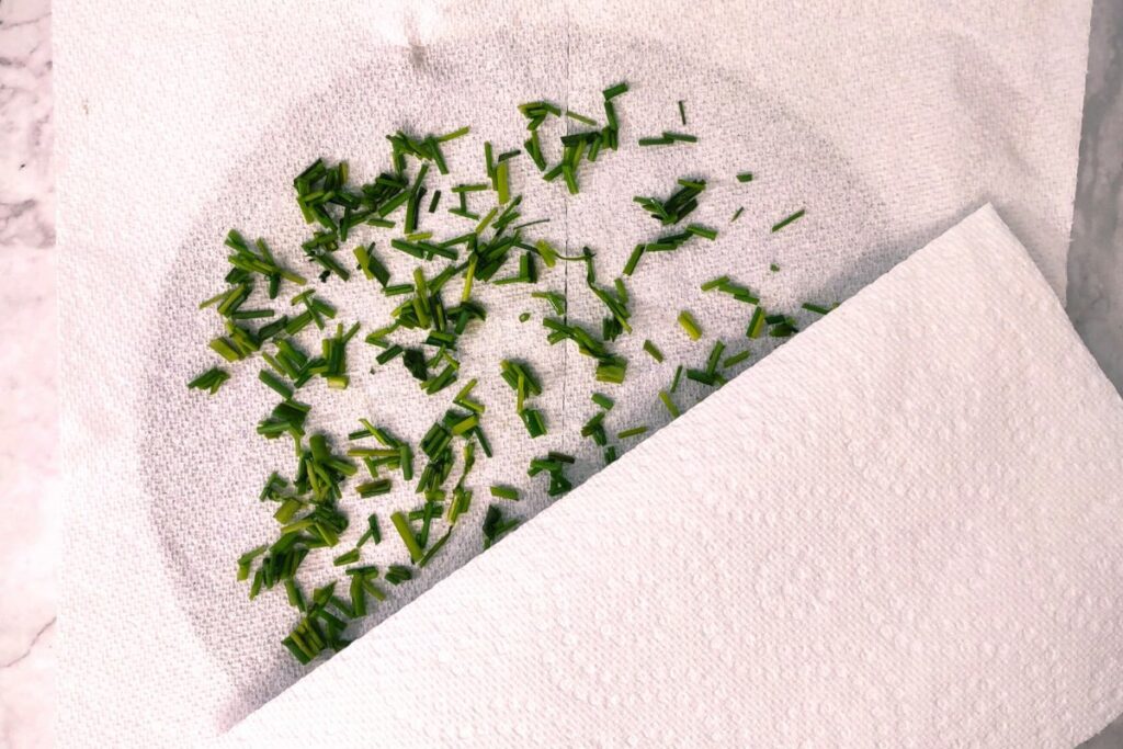 cover chives with a second paper towel before cooking in microwave