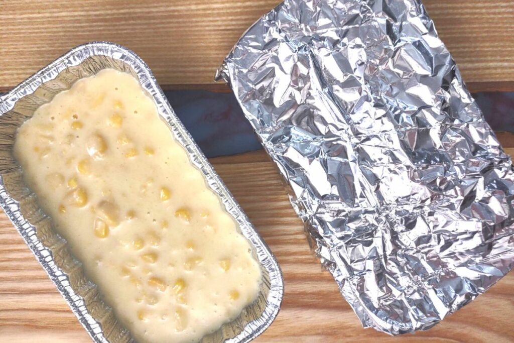 cover the corn casserole in the pan with aluminum foil