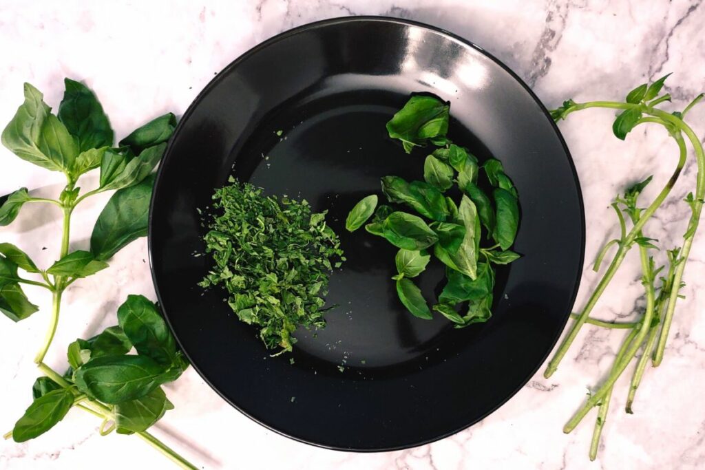 crumble basil leaves dried in the microwave with hands or mortar and pestle