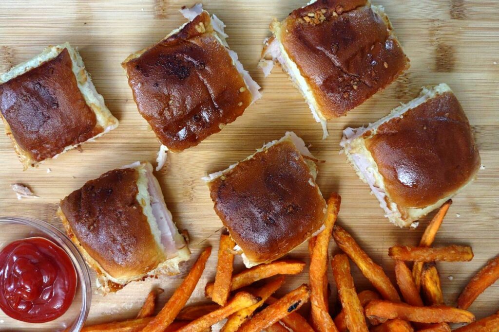 cut air fryer turkey and cheese sliders into squares when browned and toasted