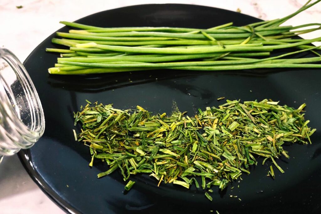 air fryer dried chives spread out across a plate