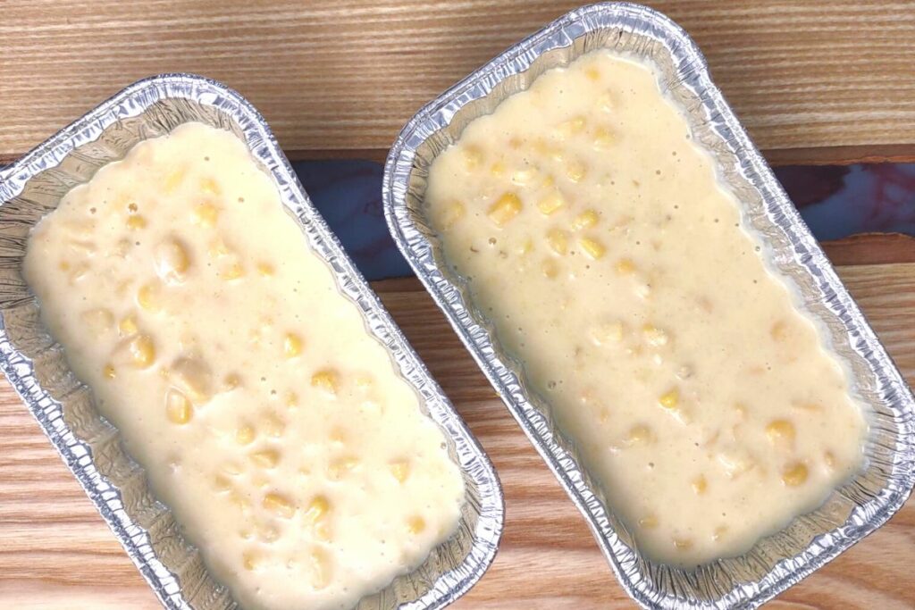 fill your corn casserole mix inside the air fryer safe pans