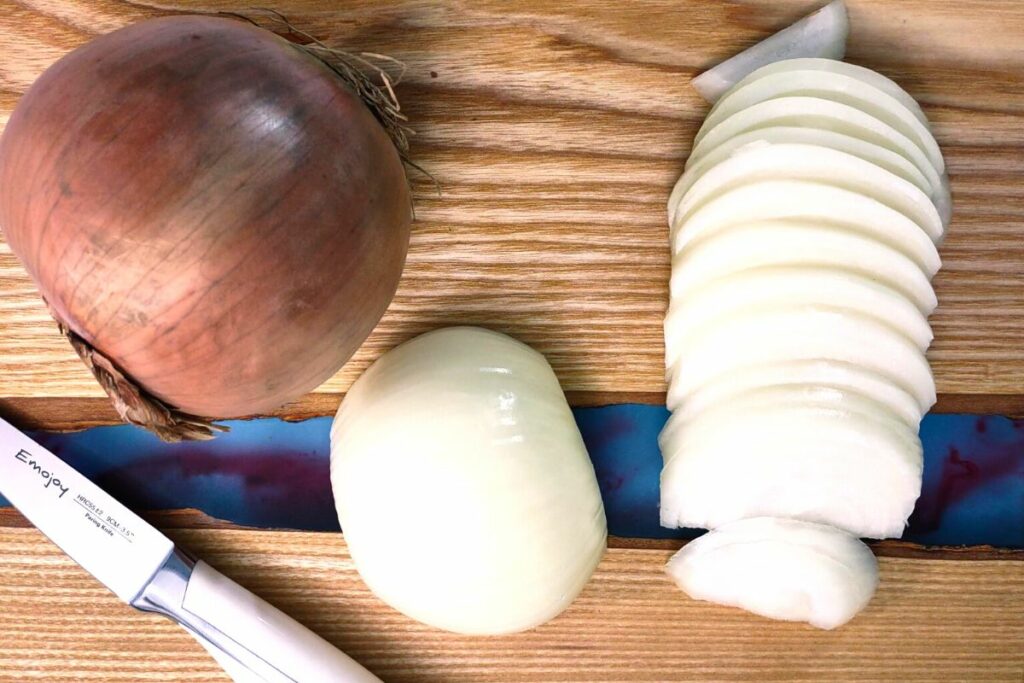 peel and slice an onion into quarter inch thick slices