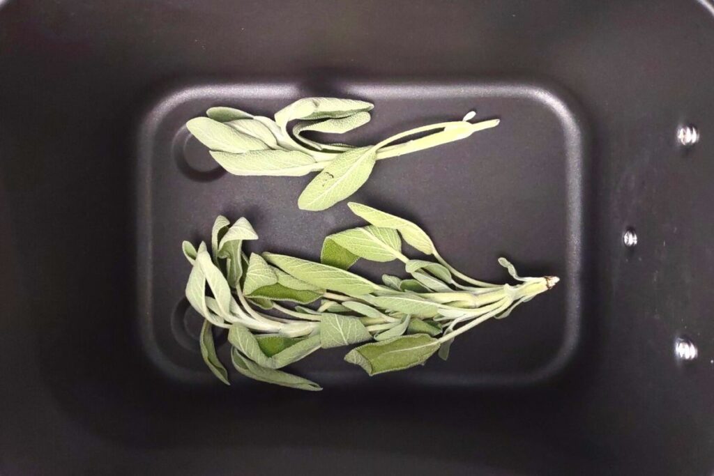 place fresh sage in the bottom of air fryer basket