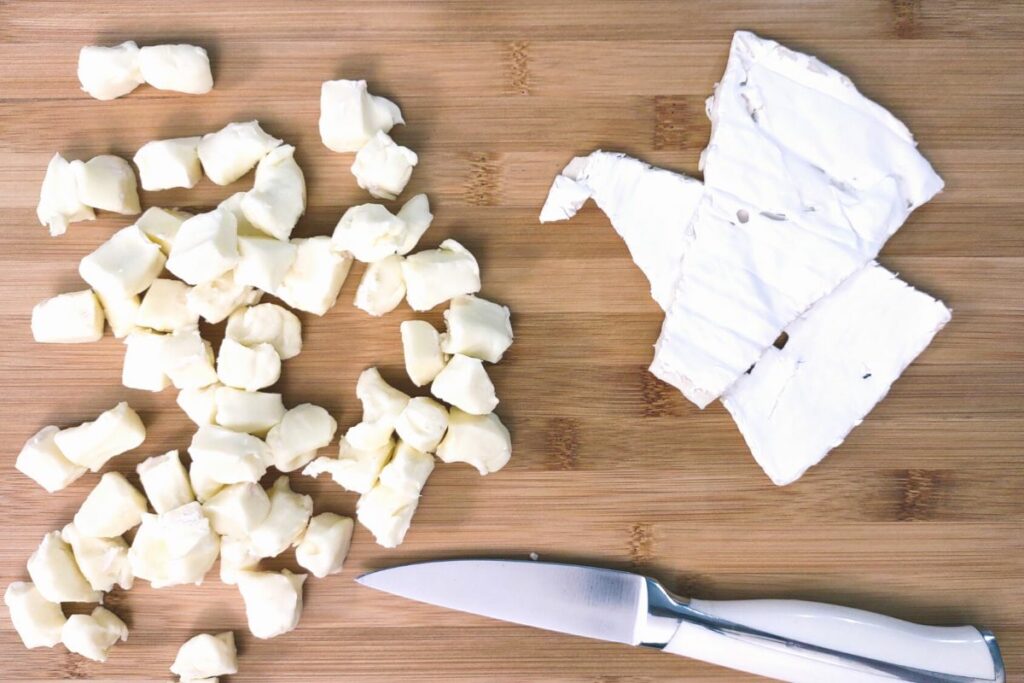 remove rind from brie and cut cheese into cubes