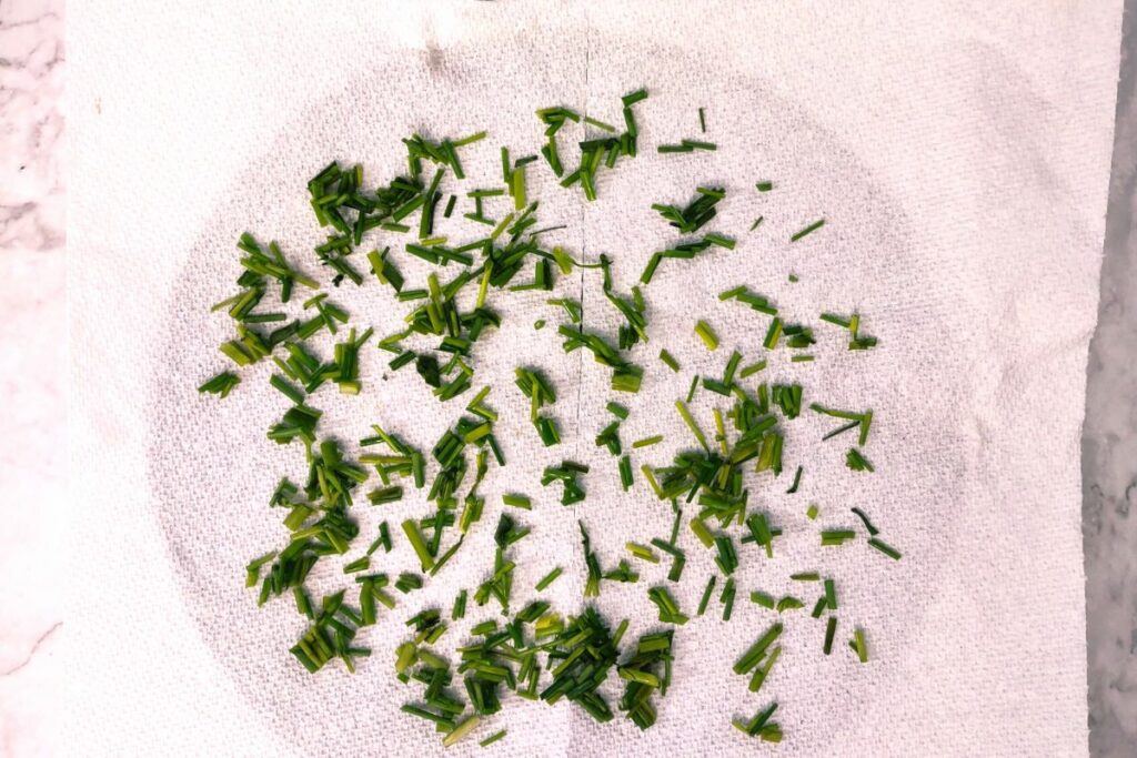 spread chives out on a paper towel