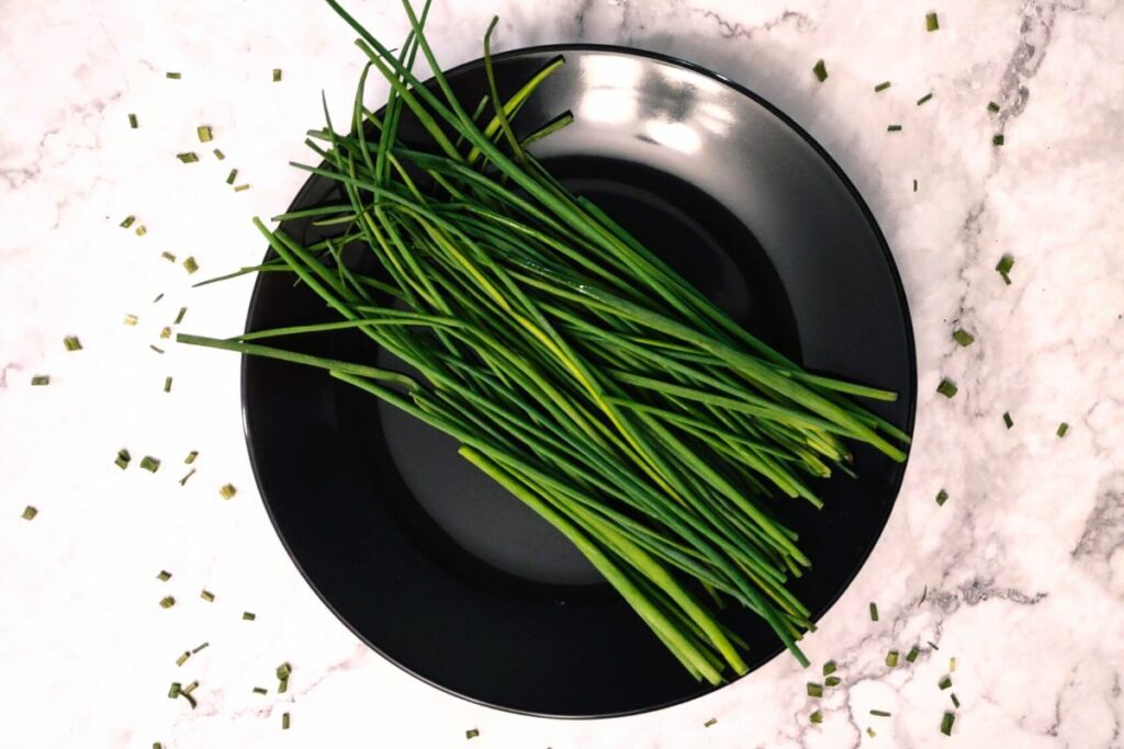 clean fresh chives stalks on a plate