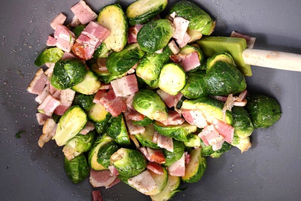 stir brussel sprouts and seasoning in a bowl