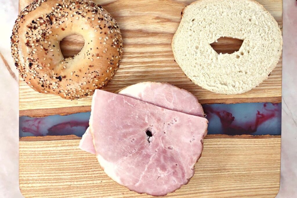 add two slices of ham to bagel