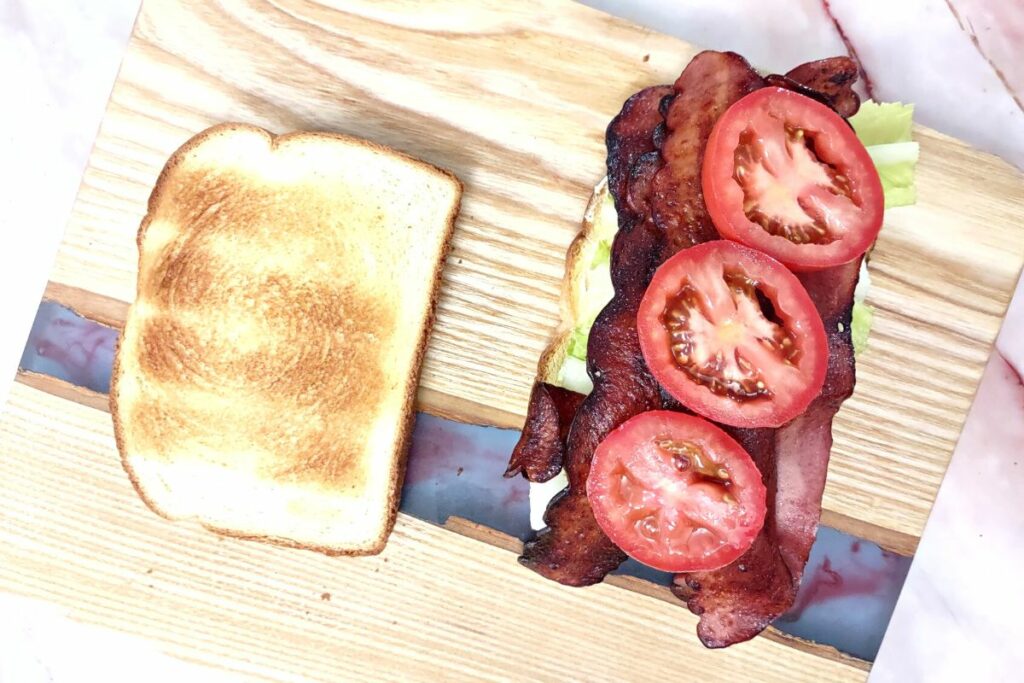 cooked turkey bacon in the air fryer on a blt sandwich