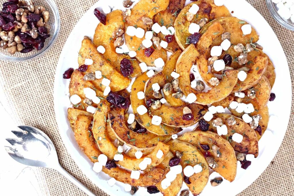 delicious roasted butternut squash slices with cranberries and cheese
