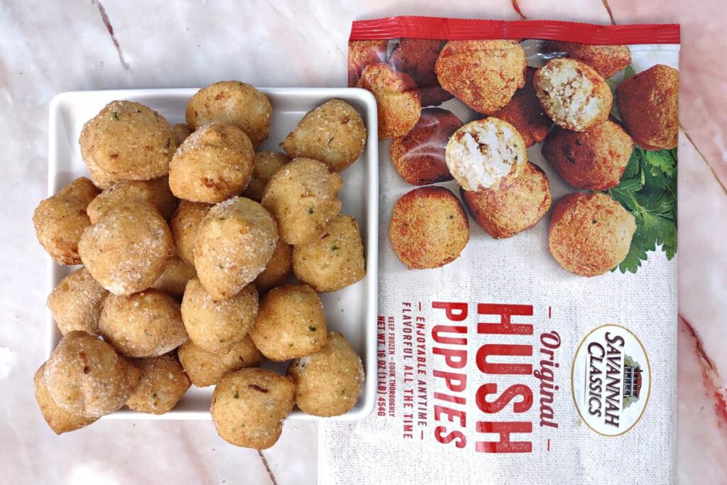 plate of frozen hush puppies next to their box