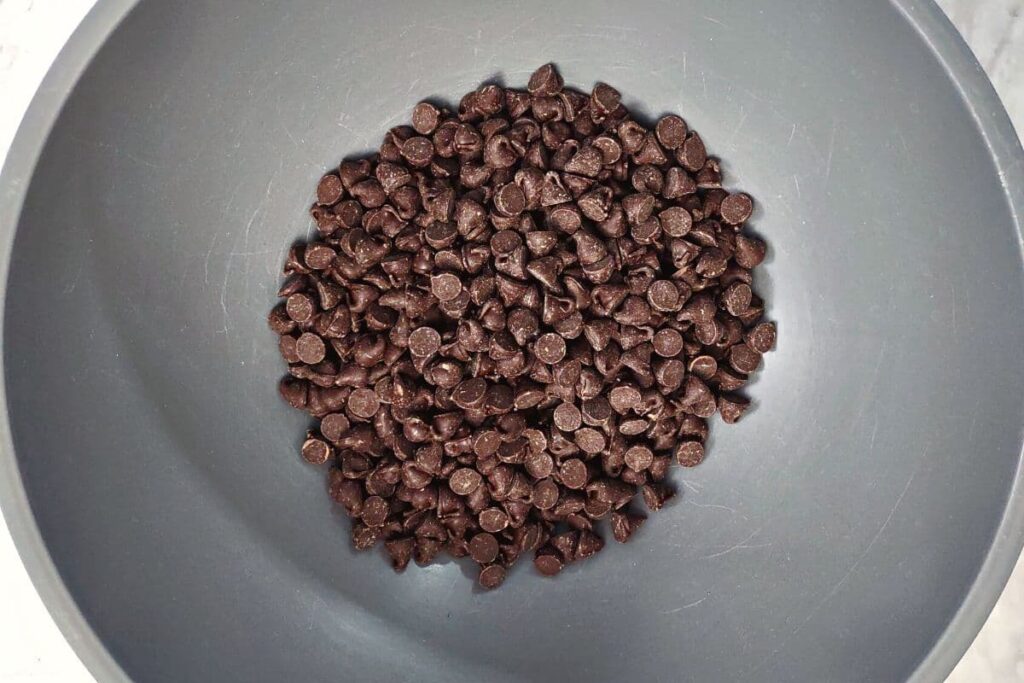 pour a bag of semi sweet chocolate chips into a bowl