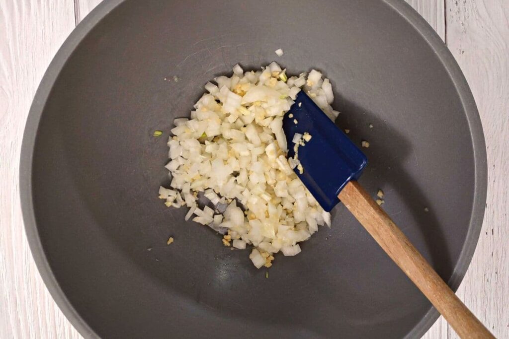 add minced garlic to onion