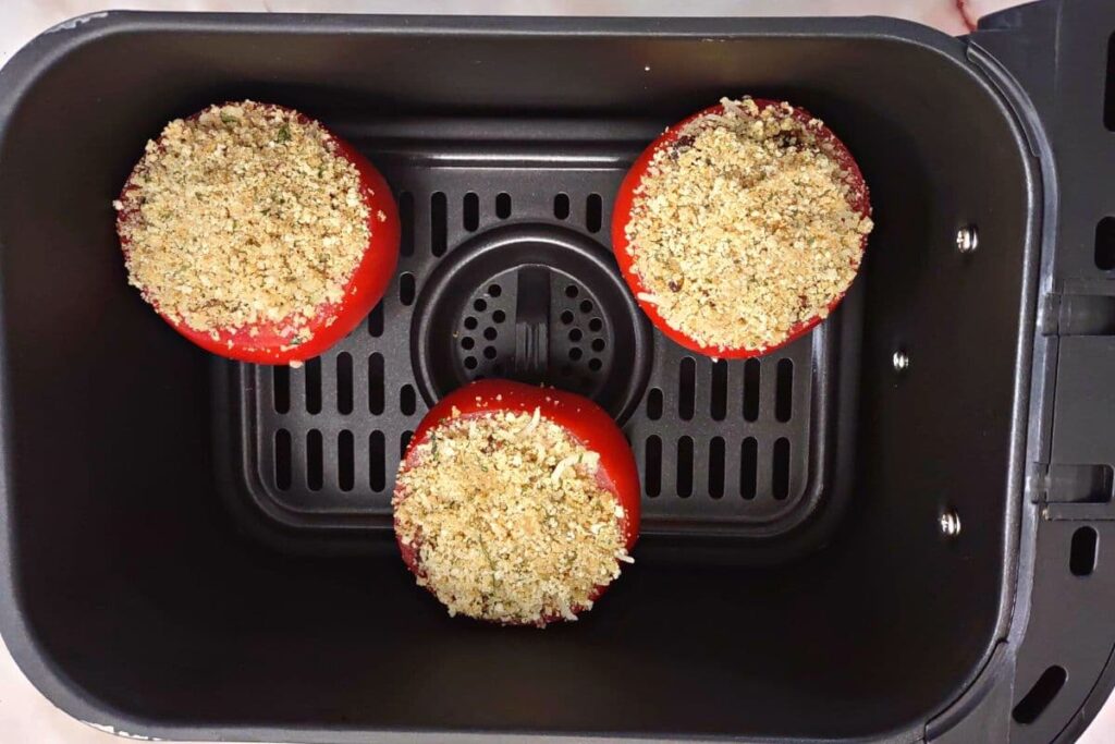 add stuffed tomatoes with cheese to air fryer basket