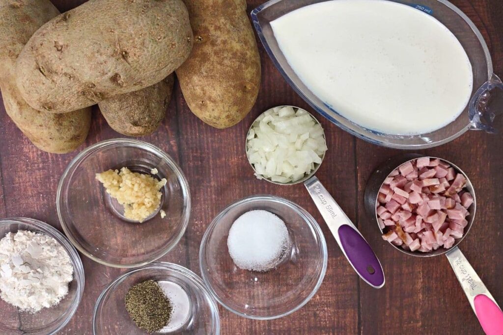 ingredients to make scalloped potatoes in the air fryer spread over a counter