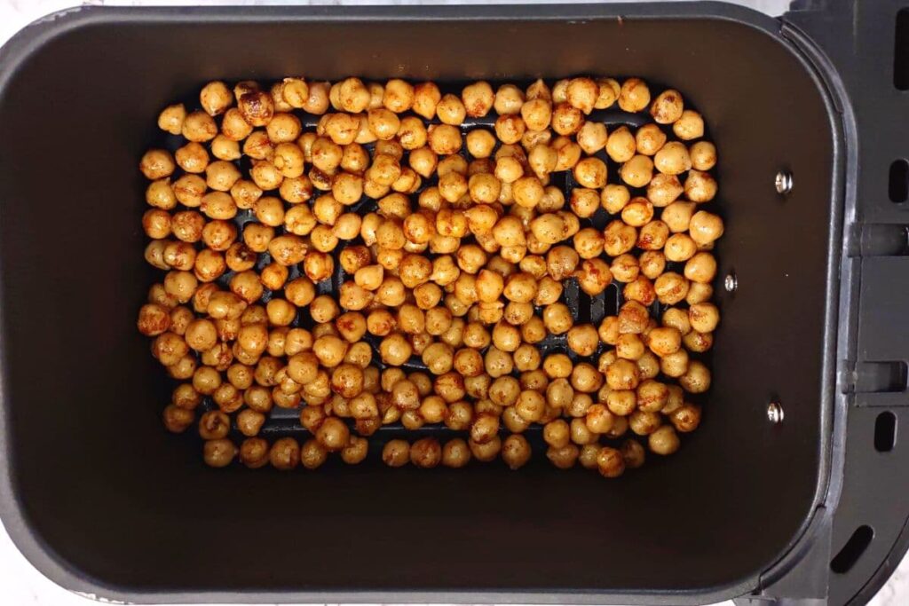 layer indian seasoned chickpeas in air fryer basket