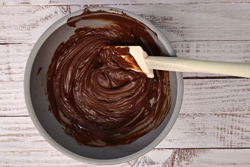 melted chocolate from the microwave with a spatula in the bowl