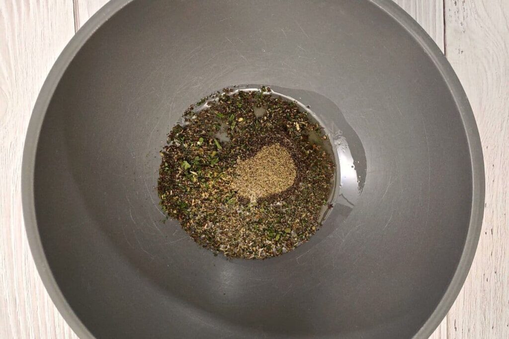 mix olive oil, salt, pepper, and herbs in a bowl
