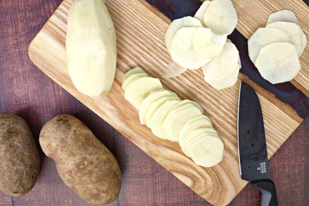 peel potatoes and slice them evenly
