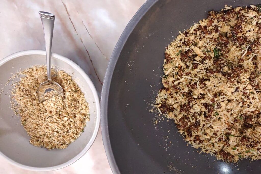 take remaining breadcrumbs and combine with olive oil