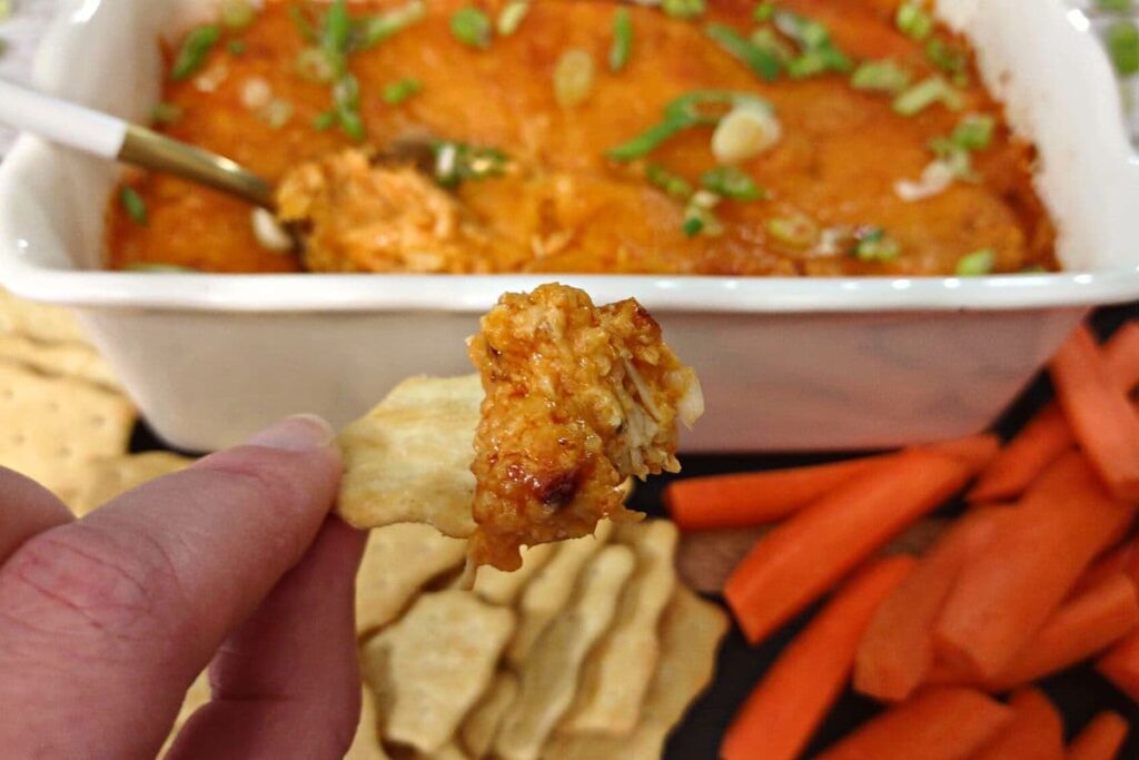 air fried buffalo chicken dip scooped on a cracker
