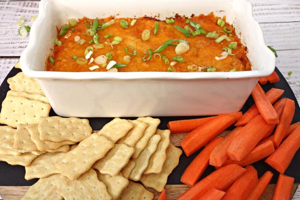 buffalo chicken dip served with carrots and crackers for dipping