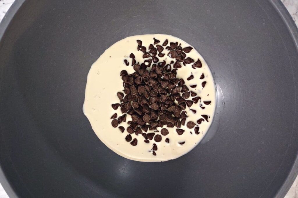 combine chocolate chips and evaporated milk in microwave safe bowl