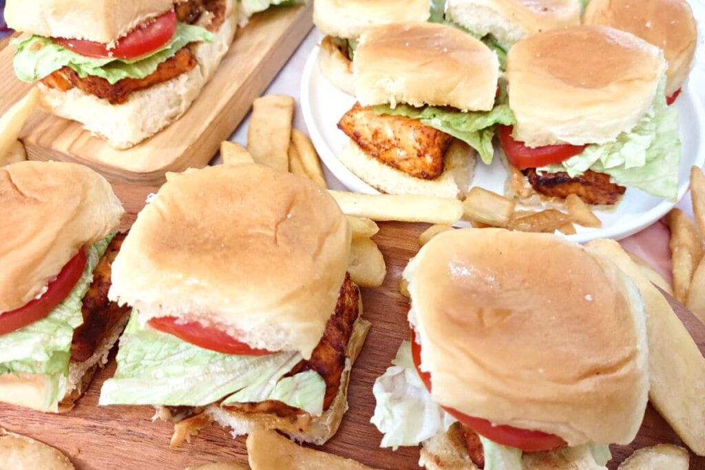 air fried salmon sliders spread out on plates and wooden platters