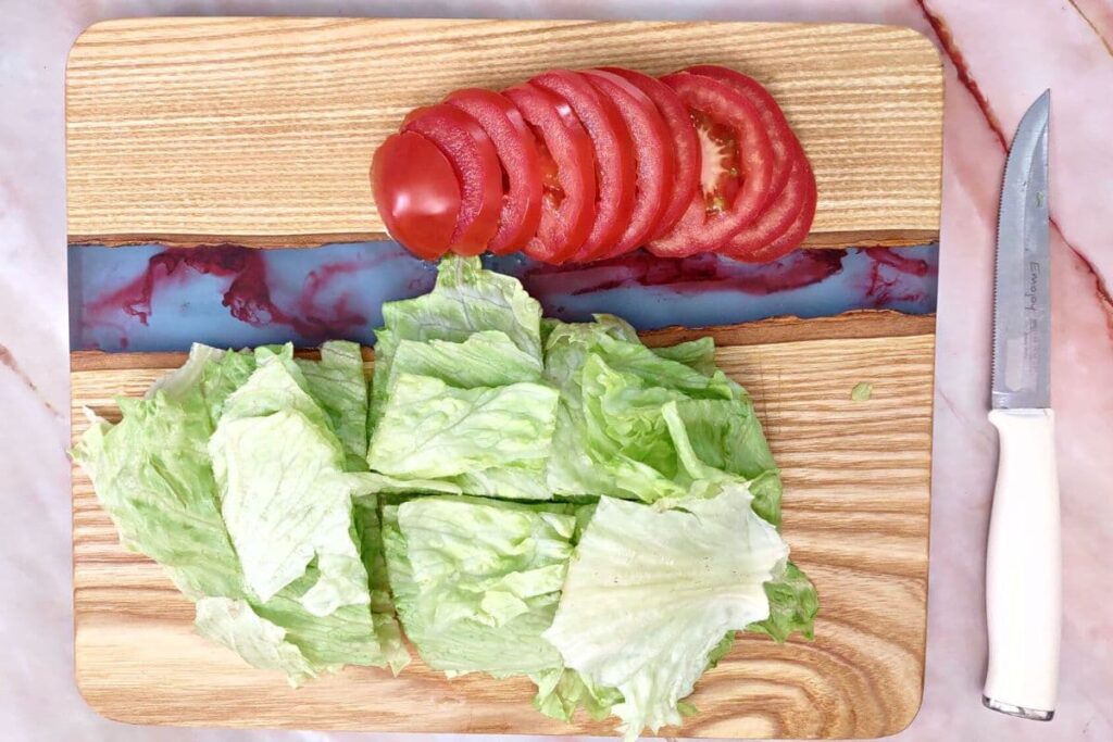 cut lettuce and tomato for sliders