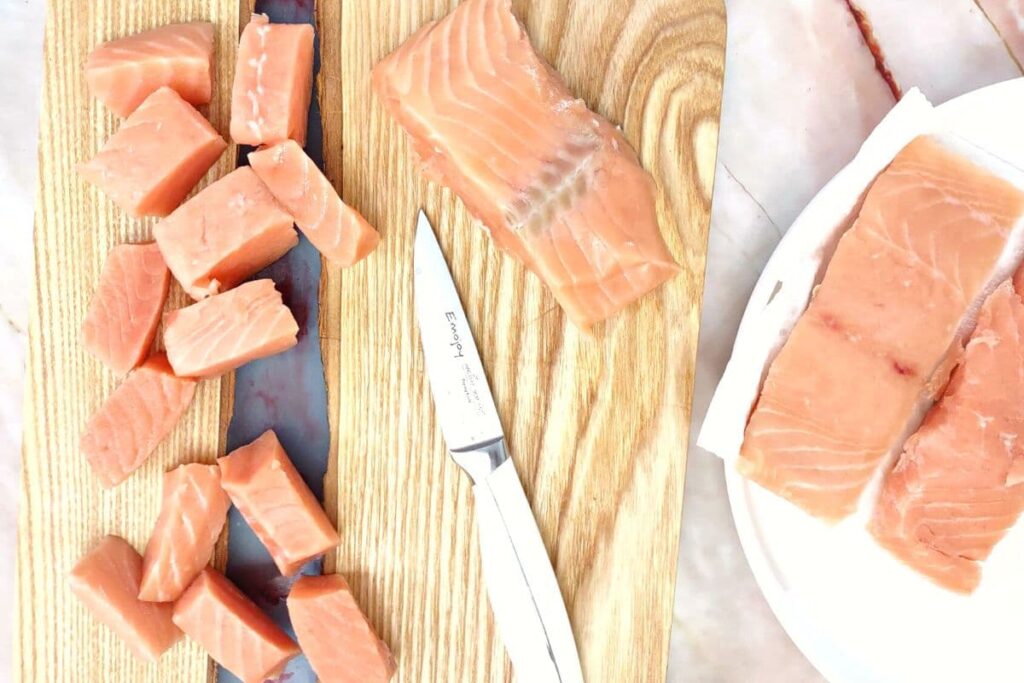 cut salmon fillet into nugget pieces