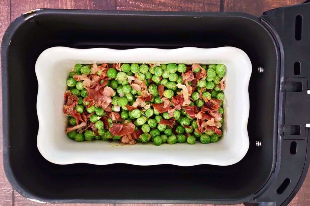 mix peas in with browned prosciutto in air fryer basket