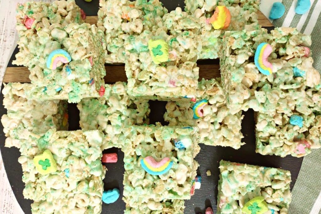 overhead view of lucky charms rice krispie treats stacked up on a platter