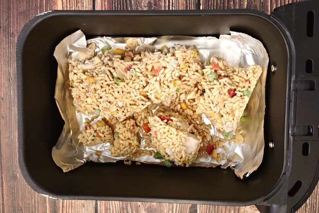 place frozen fried rice on top of foil in air fryer basket