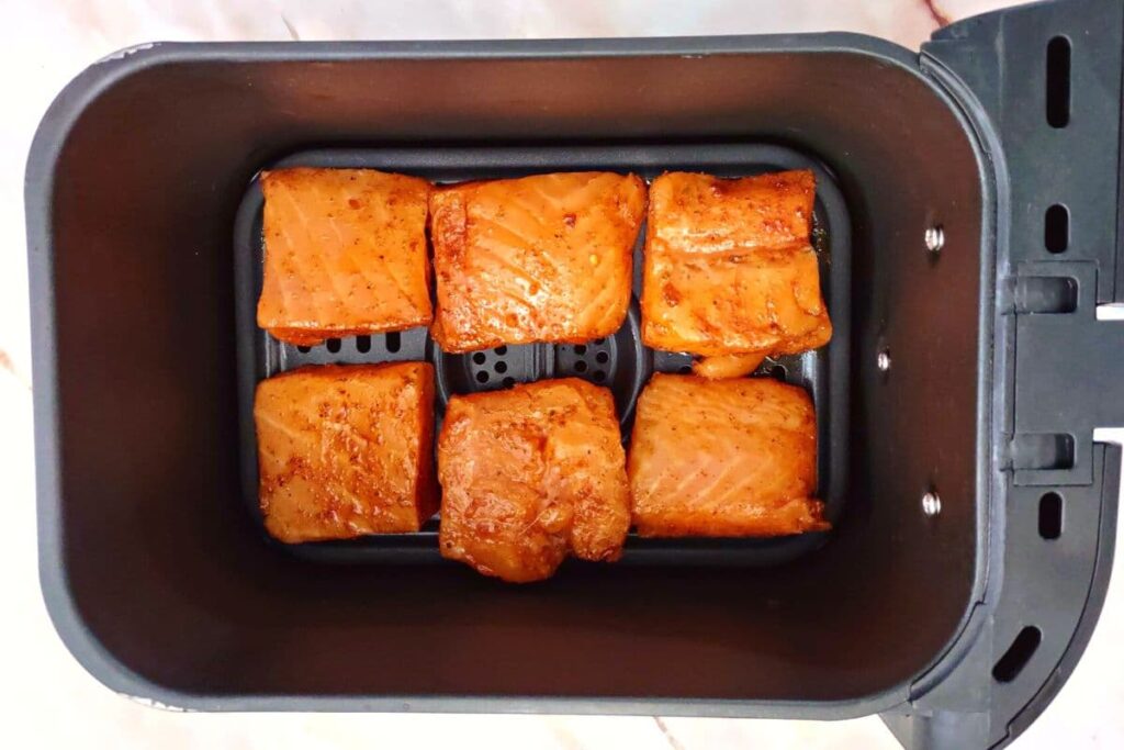 place salmon pieces in air fryer basket