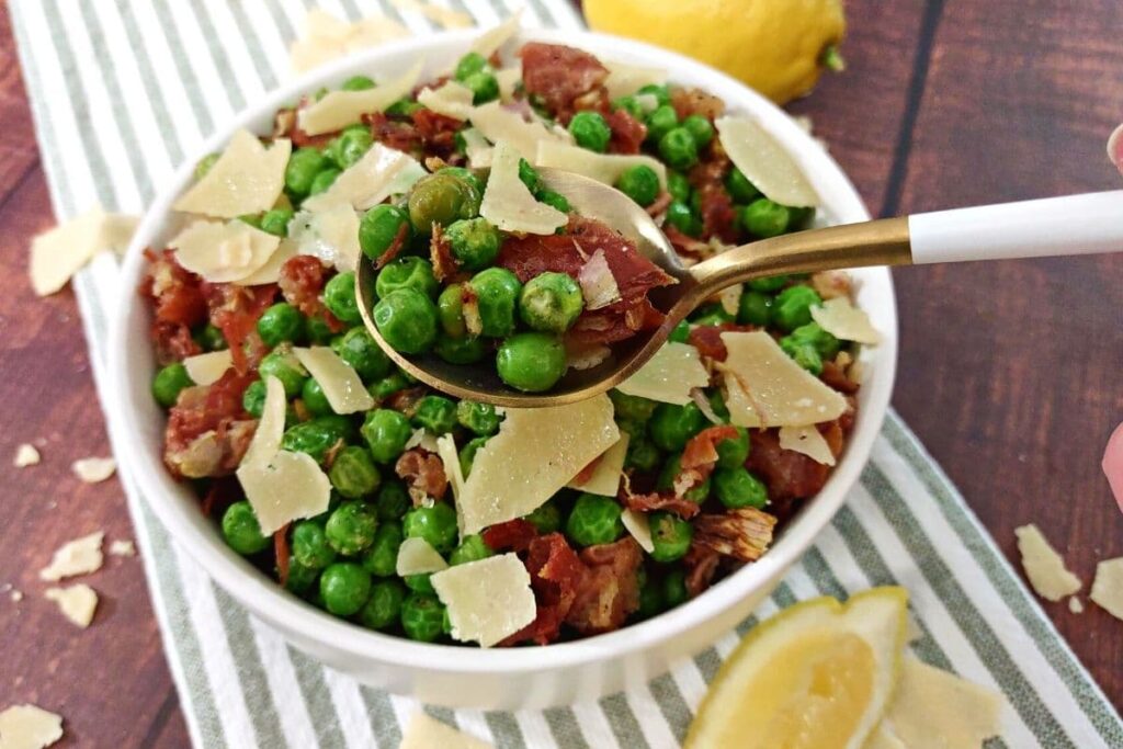 prosciutto and peas scooped up on a spoon