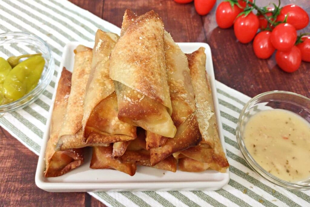 antipasto egg rolls stacked in a pyramid