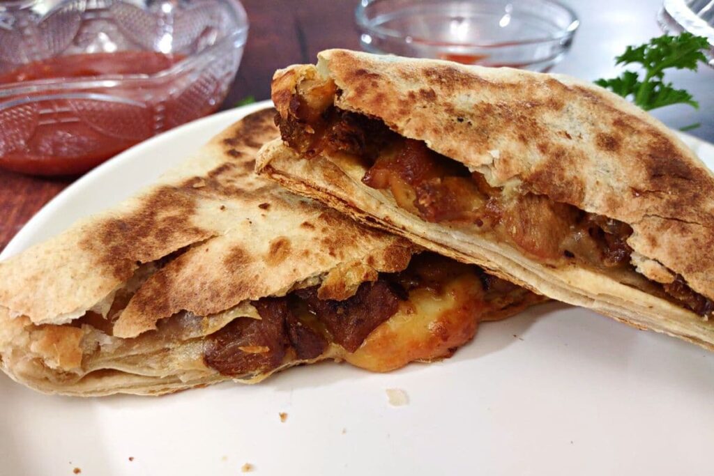 chipotle quesadilla halves stacked on top of each other on a plate