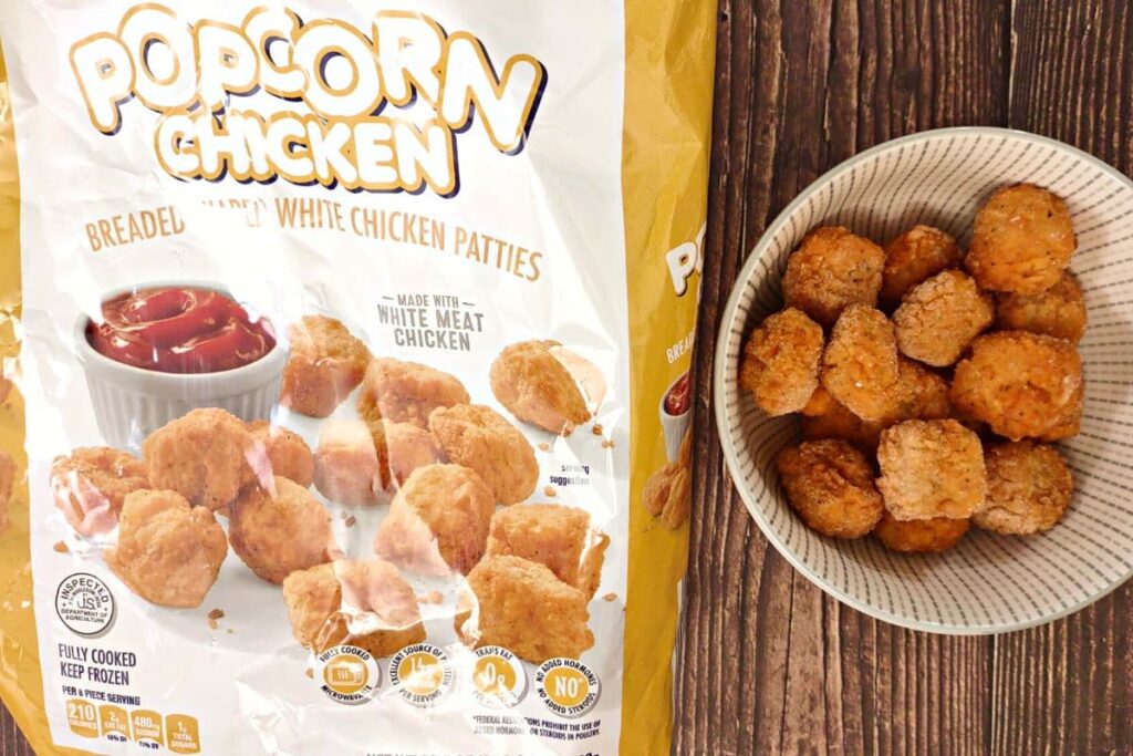 frozen popcorn chicken next to packaging