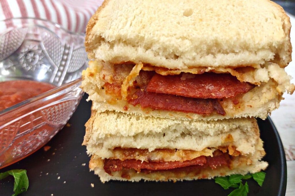 red baron pizza melt sandwich cut in half and stacked on top of each other