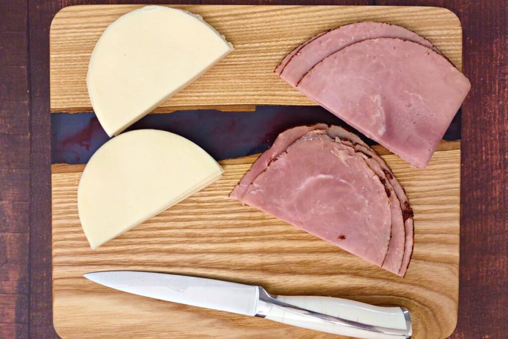 slice ham and cheese in half