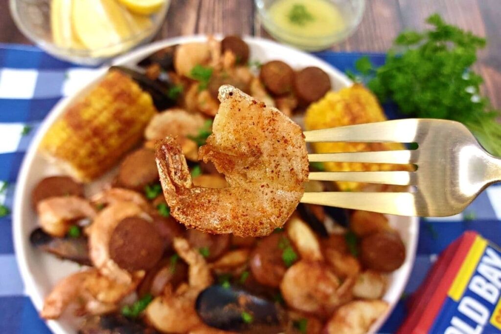 air fryer seafood boil shrimp on a fork