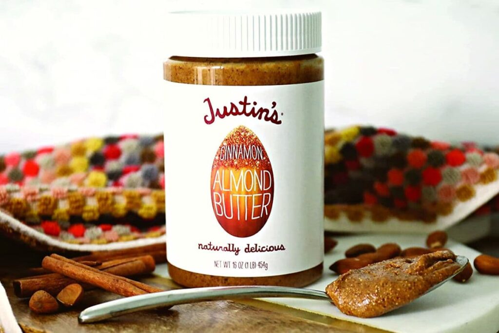 cinnamon almond butter in a jar and on a spoon