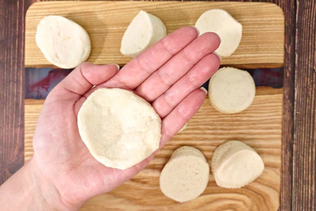 flatten each biscuit in your palm