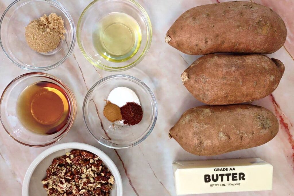 ingredients to make air fryer hasselback sweet potatoes with maple syrup and brown sugar