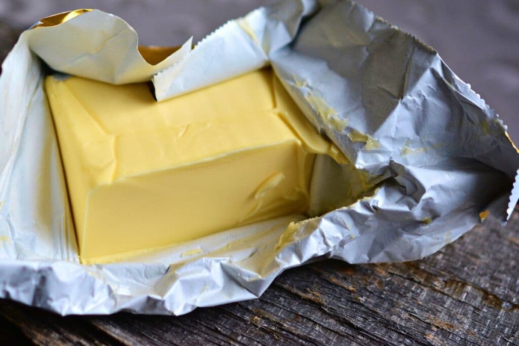 large block of butter in foil wrapper